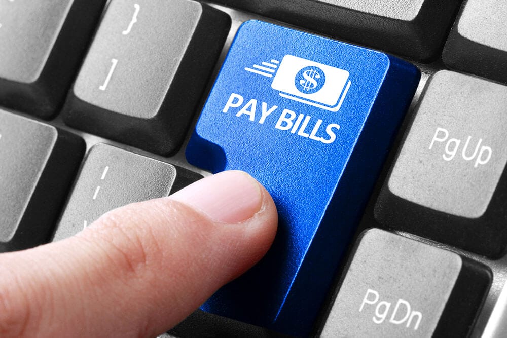 Bill Pay at Associates in Dermatology, Hampton, Virginia. Shows a keyboard with a button to click on PAY BILLS